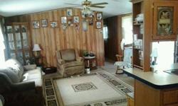 nice 3 br/2bath single wide located on almost 4 acres. quiet area. producing fruit trees, turkey and deer are abundant. has a small stream on property. mobile home on one side and able to build on the other. wonderful place to come home to after working