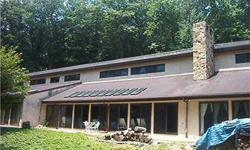 Unique custom built 5,700 sf contemporary passive solar ranch-style home on 7.24 wooded acres, tucked away on Valley Forge Mountain, minutes from historic Valley Forge Park, Great Valley Corp Ctr & King of Prussia Shopping Mall. This home features an open