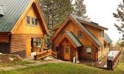 Expansive views of the Snake River and Teton Mountain range rise to greet you through expansive windows as you enter this charming log home sited above the valley floor. Privately located amidst an evergreen forest, this 3 BR home with guest house is a