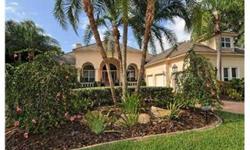 This Todd Johnston built home on 11th green of University Park Country Club has been lovingly maintained. Enter through the double leaded glass doors into the living room with pocketing sliding glass doors overlooking the lanai and pool area. From each