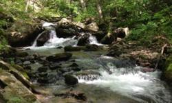 100 acres close to Asheville with big creek and views!