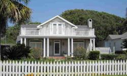 Charming, true St. Simons beach cottage, originally built in 1920, but renovated in 1997. Landscaped front yard surrounded by a white picket fence. Lots of old charm, with original hardwood floors and leaded glass windows. Rocking chair front porch with