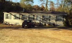 2002 4br/2ba double wide mobile home sits on 1.5 acres in Calhoun, LA. A short 15 minute drive from Monroe, this home is conveniently located about a mile from I-20, with a large yard, plenty of parking area, and extrerior lighting out front. Three