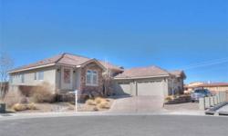 From the street view you would not know that this home is 5331sqft. Privacy and serenity are what best describe this home is located at the end of a super quiet cul-de-sac in a gated community. Beautifully done custom home in North Albuquerque acres.