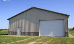 hanger building on this 1.18 acre lot! 2500 sq.ft. of concrete flooring, there is a 40' hanger door on back, & a large door on the front of building, most semi's or motor homes can fit! There is a bathroom drywalled & stubbed for a full bath, with
