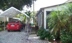 Single Wide mobile home in quiet 55 plus Private Park, Great location, big lot with plantings and private yard and covered patio, W/D in home and onsite,berber carpets, covered parking, Community center for residents, Custom master bedroom, Florida room.