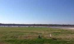 beautiful, large 0.79 acre lot on the lake in the back of Tennyson Oaks